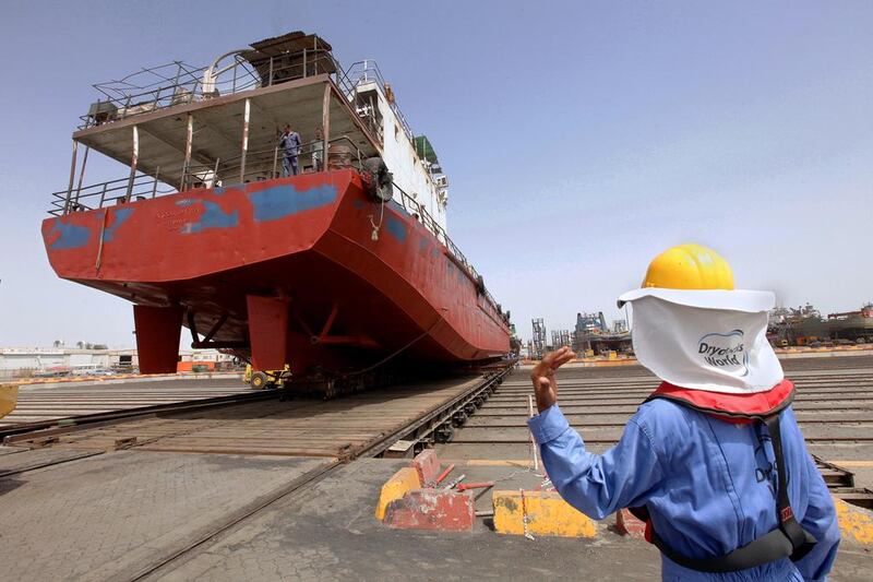 Workers move a ship at Drydocks World facilities in Dubai. Jaime Puebla / The National
