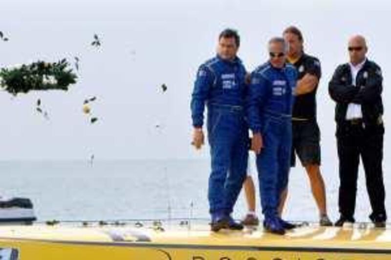 DUBAI . 12th December 2009.  POWERBOAT ACCIDENT.  Fellow competitors and crew throw a wreath into the sea at the scene of the accident yesterday(sat)  to commemorate the two men that died  . Stephen Lock   /  The National  *** Local Caption ***  SL-powerboat-005.jpg