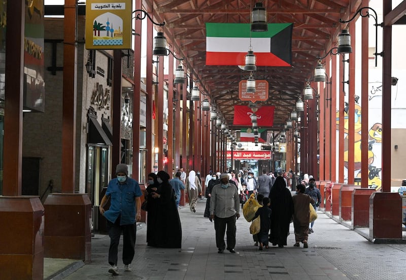 Shoppers throng Kuwait City's Souk Al Mubarakiya. Kuwaiti authorities have announced the indefinite closure of land and sea borders from 24 February, to curb Covid-19 infections. EPA