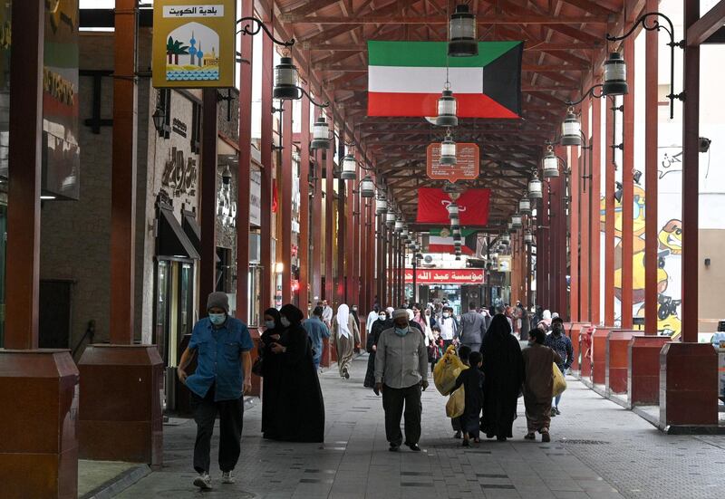 Shoppers throng Kuwait City's Souk Al Mubarakiya. Kuwaiti authorities have announced the indefinite closure of land and sea borders from 24 February, to curb Covid-19 infections. EPA