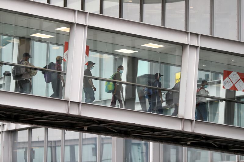 People who have been evacuated from Afghanistan arrive at Roissy Charles-de-Gaulle airport in Paris, France.