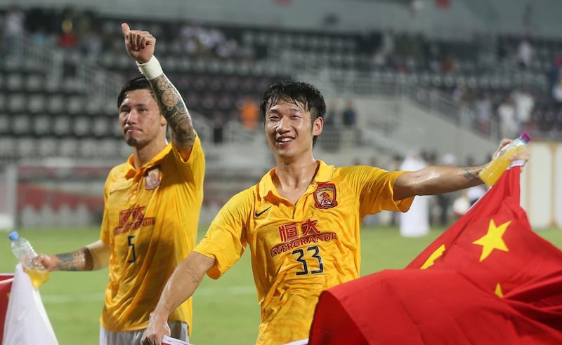 Guangzhou Evergrande players celebrate after eliminating Qatar’s Lekhwiya in the quarter-finals of the ACL. Karim Jaafar / AFP