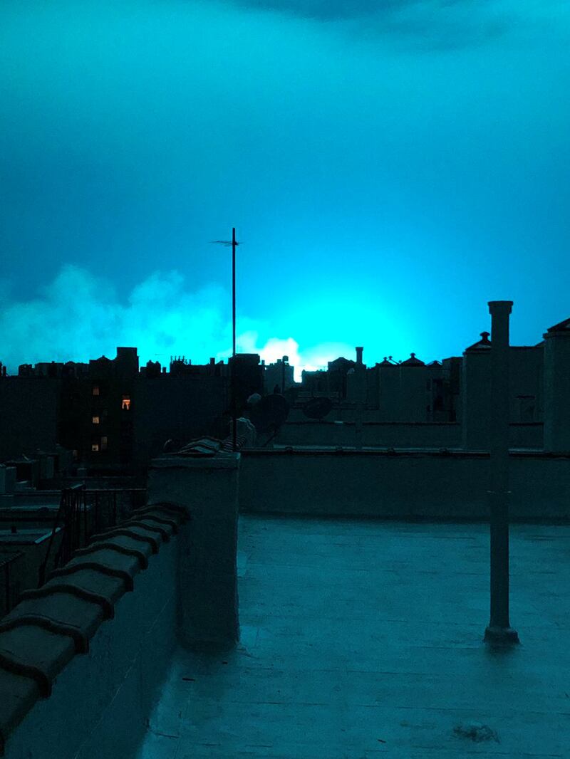 Bright blue light is seen after a transformer explosion on Thursday at an electric power station in the New York City borough of Queens. Twitter / @Eat_Work_Run / via Reuters