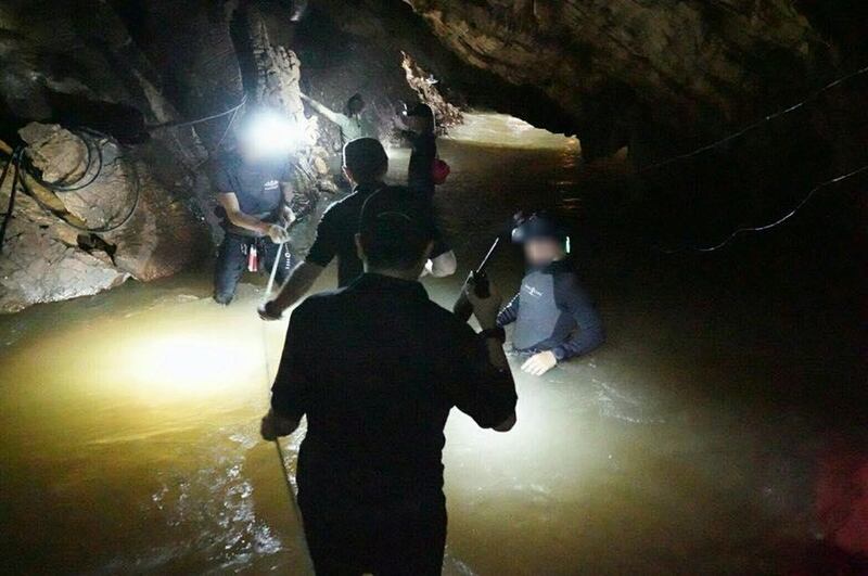 CHIANG RAI, THAILAND - JUNE 30: (EDITORIAL USE ONLY. NO SALES. NO ARCHIVING) An undated handout photo released by the Royal Thai Navy on June 30 shows a group of Thai Navy divers in the Tham Luang cave during rescue operations in Chiang Rai, Thailand. Thai Navy SEALs confirmed on Tuesday that the 12 boys, aged 11 to 16, and their 25-year-old coach have now all been extracted safely 17 days after they got trapped underground alive in a cave in northern the Thailand. The boys of the Wild Boars soccer team and their coach are to spend at least a week in a hospital in Chiang Rai Province and remain under observation due to a risk of rare infections. (Photo by Thai Navy SEAL via Getty Images)