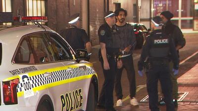A screengrab from a video shows Dev Patel talking to Australian police at the scene of a stabbing in Adelaide. Photo: Screengrab from 7News