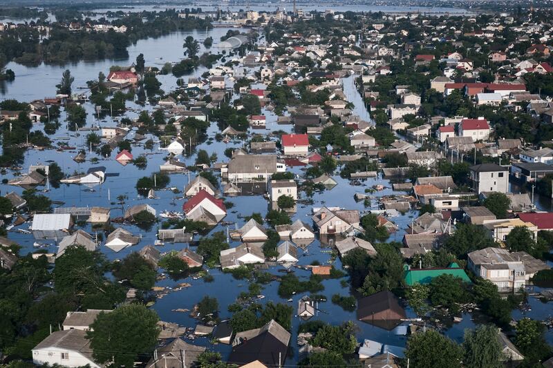 Streets are flooded in Kherson, Ukraine, Wednesday, June 7, 2023 after the Kakhovka dam was blown up.  Residents of southern Ukraine, some who spent the night on rooftops, braced for a second day of swelling floodwaters on Wednesday as authorities warned that a Dnieper River dam breach would continue to unleash pent-up waters from a giant reservoir.  (AP Photo / Libkos)