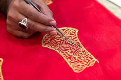 AJMAN, UNITED ARAB EMIRATES - DECEMBER 11, 2018. 

A tailor places a crystal on an embroidery at Souk Saleh. Souk Saleh, known for traditional embroidery and tailoring shops.

The souq is part of a heritage path leading from the Corniche to Ajman Museum. You���ll find it on Sheikh Humaid bin Rashid Al Nuaimi Street in the Nakheel neighbourhood, a busy commercial centre known for its traditional-styled buildings.

(Photo by Reem Mohammed/The National)

Reporter: SALAM 
Section:  NA