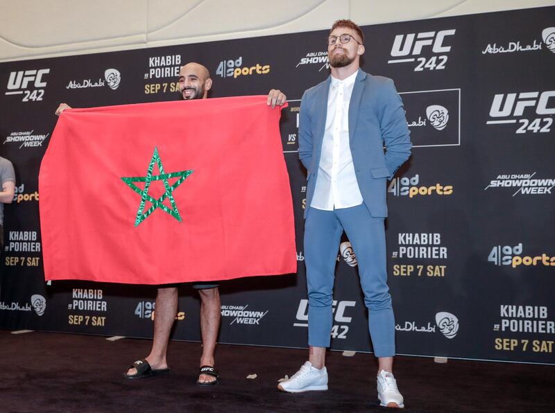 Abu Dhabi, United Arab Emirates, September 5, 2019.   STORY BRIEF: UFC Ultimate Media Day at the Yas Hotel.  --  
(L-R) Ottman Azaitar proudly raises the flag of Morocco on stage beside Teemu Packalen for the  UFC lightweight class.
Victor Besa / The National
Section:  SP
Reporter:  Dan Sanderson