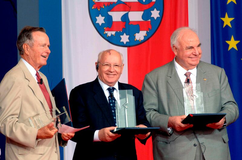 Bush, Gorbachev and former German chancellor Helmut Kohl hold the 'Point Alpha Award' at the former demarcation line between East and West Germany in June 2005. EPA