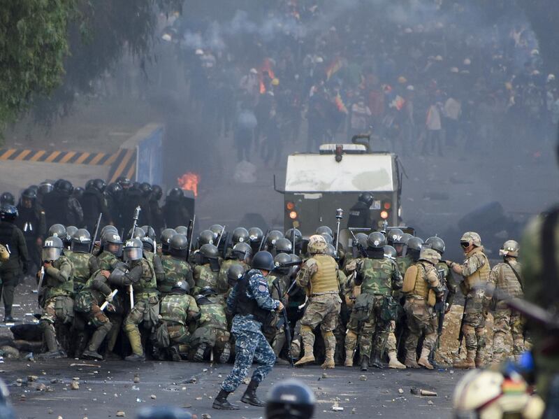 Security forces clash with supporters of former President Evo Morales in Sacaba, Bolivia. A least five people died and dozens were injured during the clashes. AP Photo