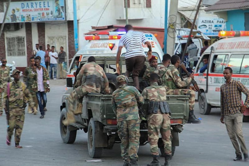 Somalia military personnel arrive at the scene of a bomb explosion at the Afrik Hotel in Mogadishu. EPA