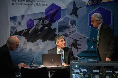Delegates at an electronic warfare exhibition in Liverpool. Western militaries need to be aware of private companies hiring their top cyber warfare specialists, an expert has warned. AFP
