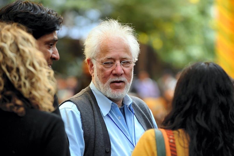 Sri Lankan-born Canadian Novelist Michael Ondaatje (C) interacts with fellow authors during the DSC Jaipur Literature Festival (JLF) in Jaipur on January 22, 2012.  Television chatshow queen Oprah Winfrey received a rock star's welcome when she spoke on Sunday to a heaving audience of thousands of fans at the DSC Jaipur Literature Festival in India.Winfrey, wearing a gold and red Indian outfit, told the packed crowd that her love of books had helped her education and enabled her to rise from a poor childhood in Mississippi to become one of the world's most influential women. AFP PHOTO / Prakash SINGH / AFP PHOTO / PRAKASH SINGH