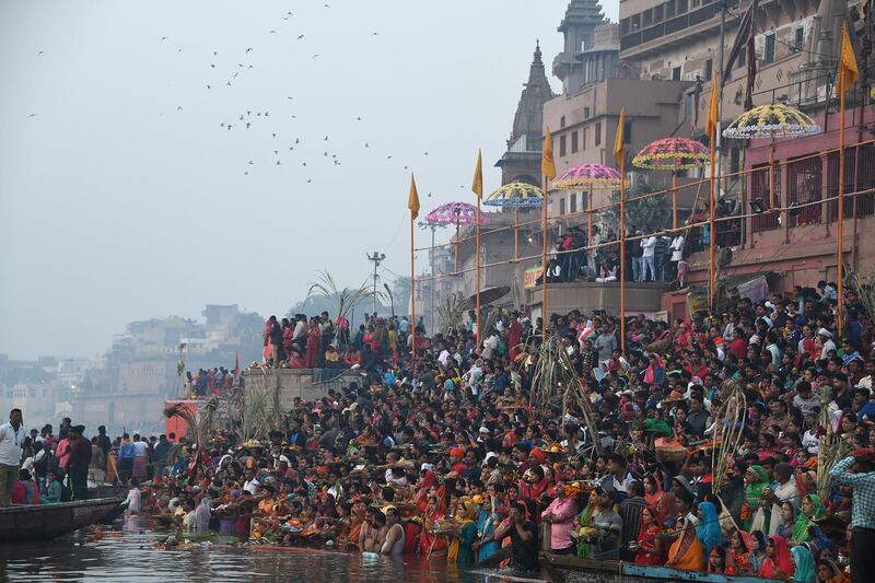 Indian devotees take part in a ritual worshipping the sun god on the banks of the holy river Ganges in Varanasi. AFP