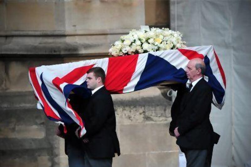 Pallbearers carry the coffin of former British prime minister Margaret Thatcher to the Crypt Chapel of St Mary Undercoft in the Houses of Parliament in London on the eve of her ceremonial funeral.