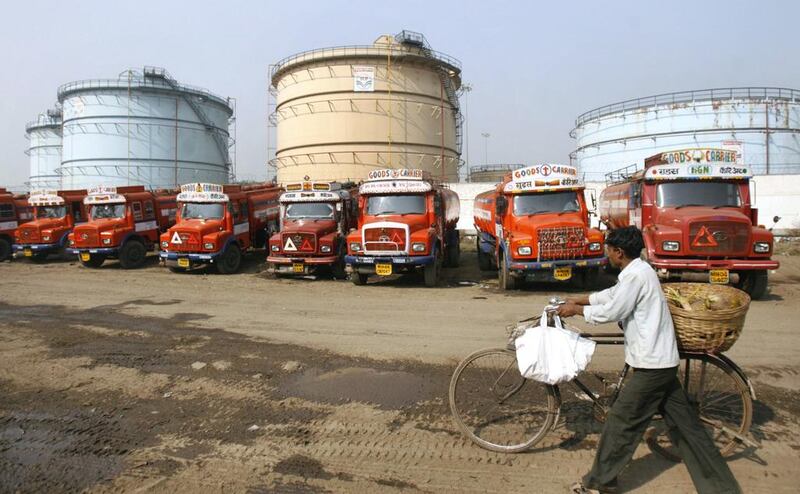 Oil tankers are stationed for re-filling at a petroleum company in Mumbai. Punit Paranjpe / Reuters