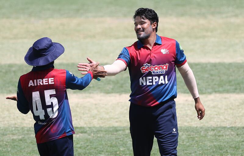 Nepal's Karan KC celebrates after taking the wicket of UAE's Ahmed Raza. 