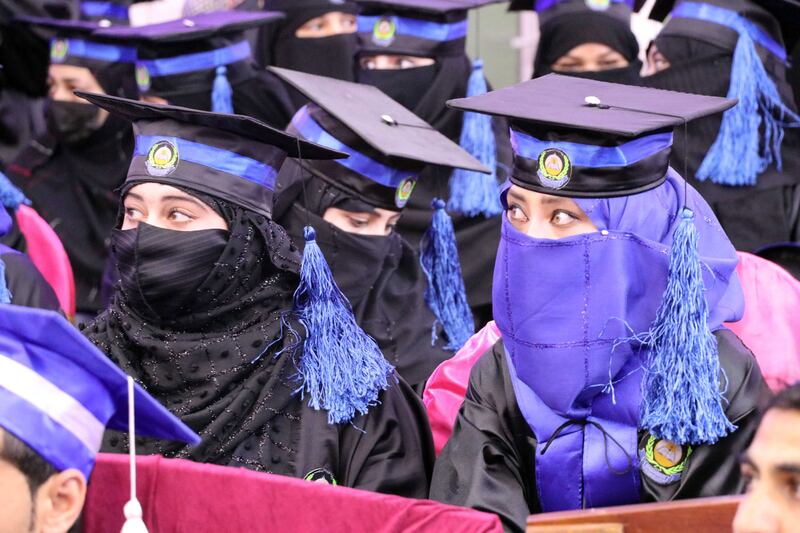 Afghan students graduate in Kandahar but women are now banned from classes nationwide. EPA