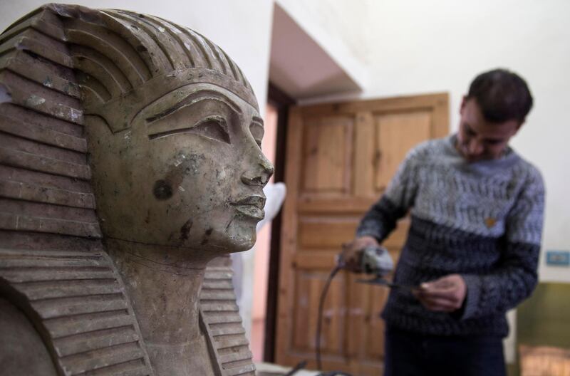 An artist works at the replica production unit located at Salah Al Din Citadel in Cairo, Egypt. EPA