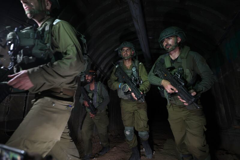 A photo taken while embedded with the Israeli Army shows soldiers inside a tunnel 400 meters away from the Erez crossing between Gaza and Israel, in the Palestinian town of Beit Hanun, northern Gaza Strip, 15 December 2023 (issued 17 December 2023).  At least 18,000 Palestinians and at least 1,200 Israelis have been killed, according to the Palestinian Health Ministry and the Israel Defense Forces (IDF), since Hamas militants launched an attack against Israel from the Gaza Strip on 07 October, and the Israeli operations in Gaza and the West Bank which followed it.   EPA / ATEF SAFADI