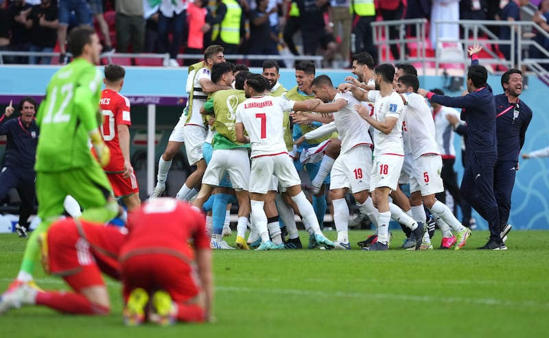 Roozbeh Cheshmi celebrates scoring Iran's first goal against Wales. PA