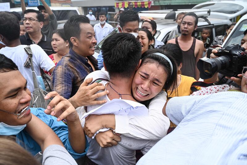 A man's loved ones celebrate his release from prison in Yangon, Myanmar, after the junta pardoned 2,153 prisoners held under a law criminalising encouraging dissent against the military. AFP