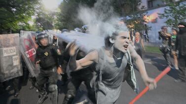 Demonstrators clash with police during a pro-Palestinian rally in front of the Israeli embassy in Mexico City. AFP