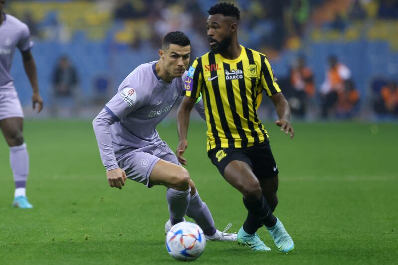 Al Ittihad's Saudi defender Muhannad Al Shanqeeti is marked by Al Nassr's Portuguese forward Cristiano Ronaldo. AFP