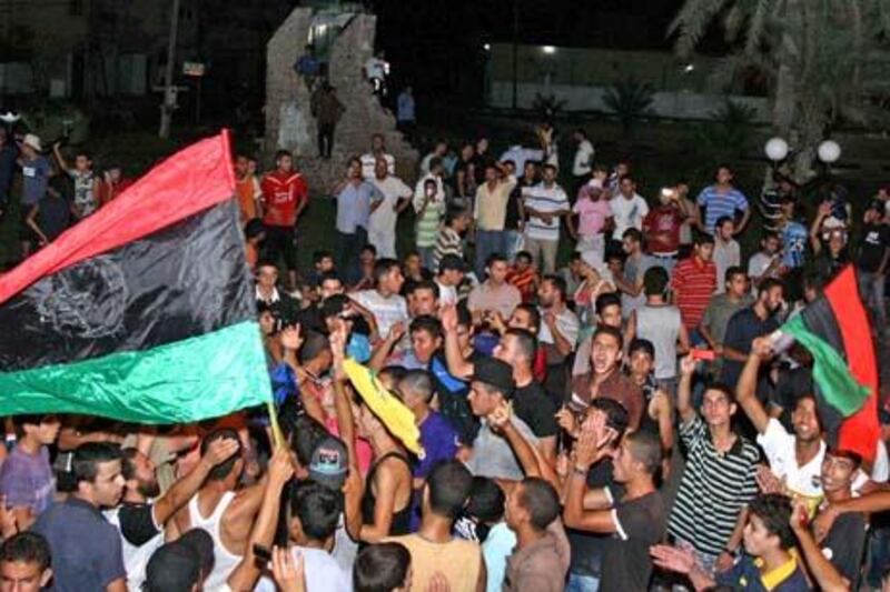 Rebels in Tajura, a suburb of Tripoli, celebrating the control, the entire area Tajoura, in the early morning on Monday, August 22, 2011.  Libyan rebels surged into Tripoli Sunday in a final drive to oust Moamer Kadhafi, seizing swathes of the capital including the symbolic Green Square and arresting the strongman's son, Seif al-Islam.    AFP PHOTO / STR

