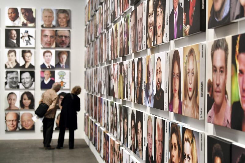 BASEL, SWITZERLAND - JUNE 13:  Visitors look at the artwork "Celebrity Look-Alikes" by Rob Pruitt during the press preview for Art Basel at Basel Messe on June 13, 2017 in Basel, Switzerland. Art Basel is one of the most prestigious art fair in the world showcasing the work of more than 4,000 artists selected by 300 leading art galleries.  (Photo by Harold Cunningham/Getty Images)