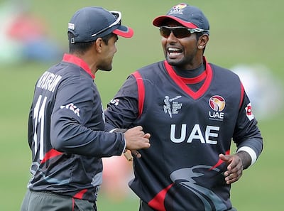 UAE players Khurram Khan, left, and Krishna Karatechat during their Cricket World Cup Pool B match against the West Indies in Napier, New Zealand, Sunday, March 15, 2015. Ross Setford / AP Photo