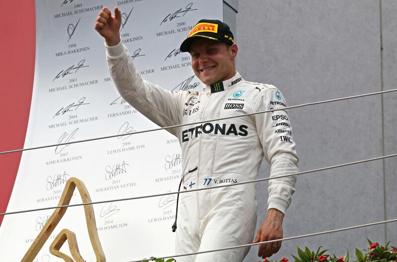 Valtteri Bottas salutes the crowd after his win in Austria. Ronald Zak / Associated Press