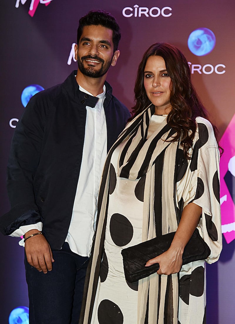 Here, there, everywhere: Neha Dhupia and Angad Bedi. AFP