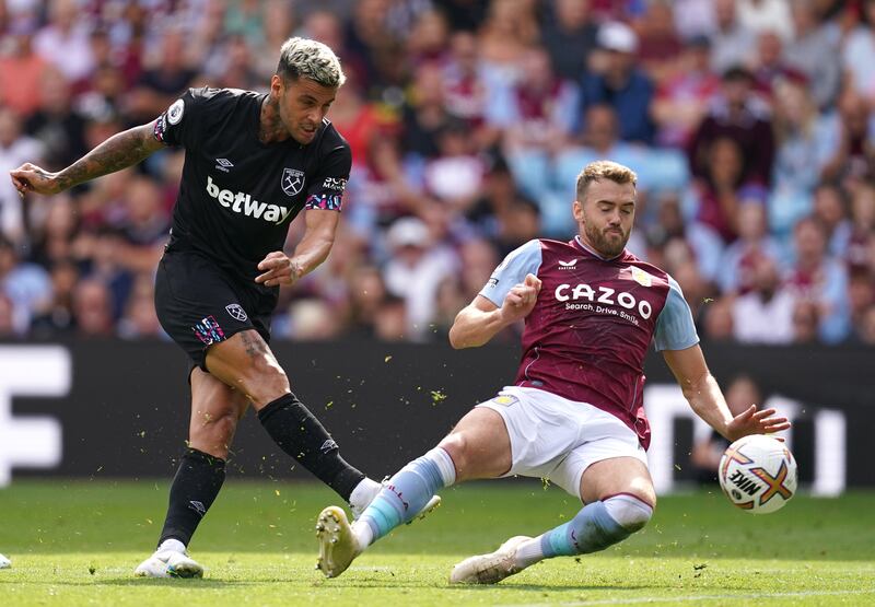 West Ham United's Gianluca Scamacca has a shot at goal under pressure from Aston Villa's Calum Chambers. AP