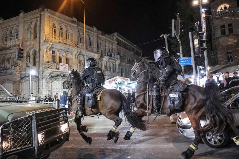 Israeli mounted policemen ride during the clashes. AFP