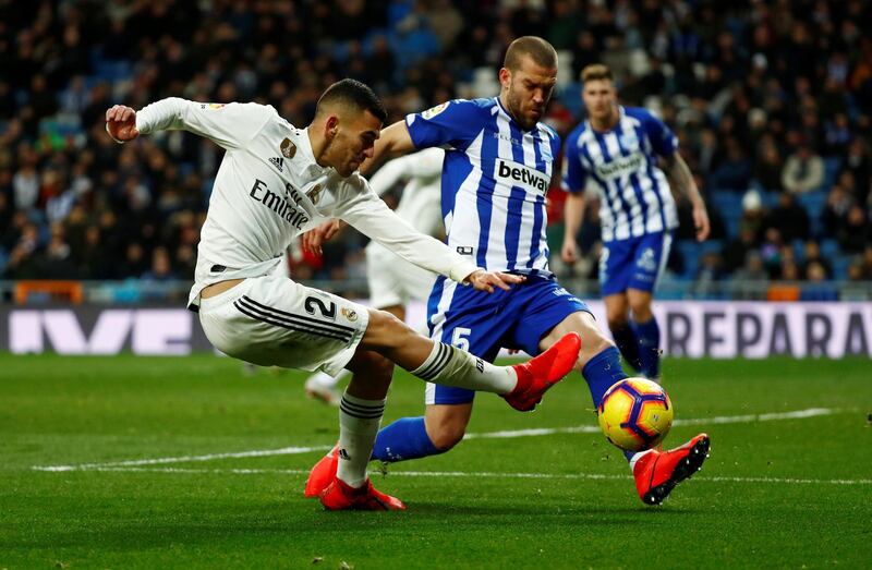 Real Madrid's Dani Ceballos in action with Alaves' Victor Laguardia. Reuters