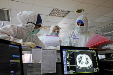 Iranian medical personnel, wearing protective gear, work at a ward of a hospital in Tehran on March 1, 2020. AFP