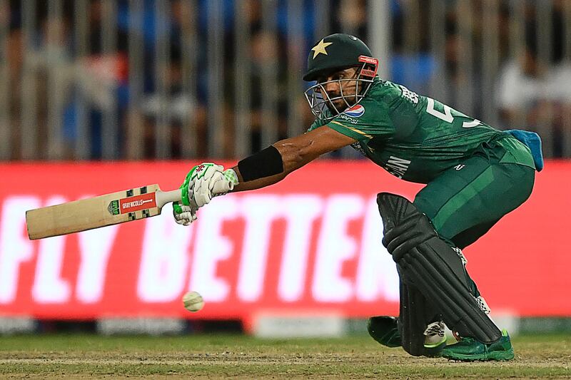 Pakistan's captain Babar Azam reaches for the ball on Sunday. AFP