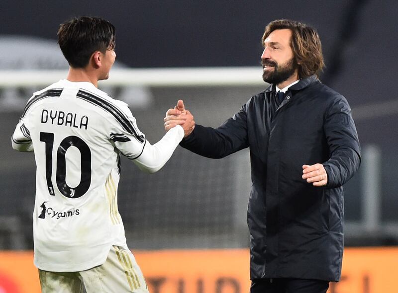 Juventus manager Andrea Pirlo shakes hands with Paulo Dybala after the match. Reuters