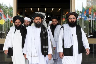 Members of a Taliban delegation, led by chief negotiator Mullah Abdul Ghani, centre front, leave after peace talks with Afghan senior politicians in Moscow, Russia. Reuters 