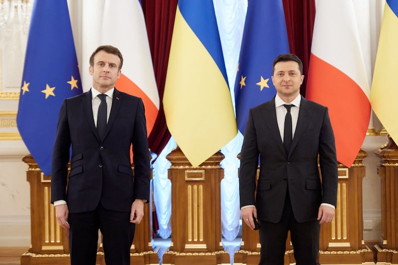 French President Emmanuel Macron and President Volodymyr Zelenskyy of Ukraine pose during a meeting in Kyiv on February 8, 2022. Ukrainian Presidential Press Service via AFP