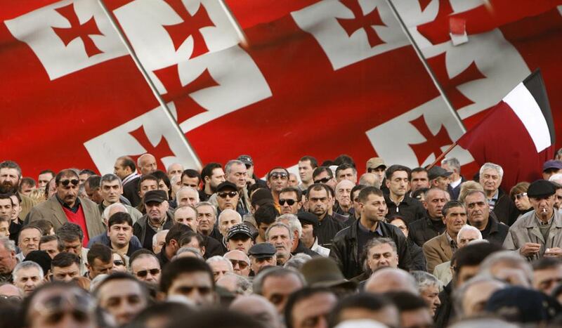 The Georgian flag is displayed at a rally in the capital Tbilisi. The Russo-Georgian war in 2008 was the first time the new "Putin doctrine" was displayed. It is now being used in Syria. (Reuters/David Mdzinarishvili)