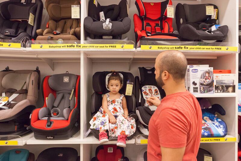 DUBAI, UNITED ARAB EMIRATES, 18 JULY 2017. Omar Al Darabkeh and his two year old daughter Issabella (Jordanian) shop for a car seat at The Baby Shop in Ibn Battuta Mall. (Photo: Antonie Robertson/The National) Journalist: Ruba Haza. Section: National.