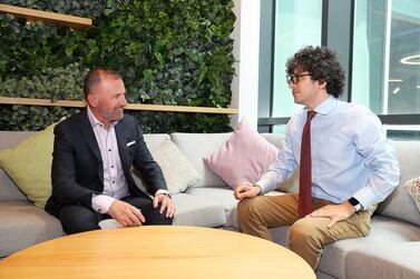 Left to Right- Thomas McCarthy, Executive Director at ASPIRE, Abu Dhabi Autonomous Racing League, A2RL and Cody Combs, reporter with The National at the TwoFour54 Creative Hub on Yas Island in Abu Dhabi. Pawan Singh / The National