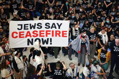 Activists from the group 'Jewish Voice for Peace' protest Israel's expected ground assault on Gaza and call for an immediate ceasefire, inside the Cannon House Office Building next to the US Capitol in Washington DC, USA. EPA / WILL OLIVER