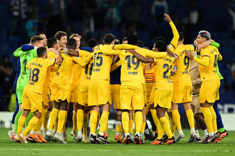 Barcelona players celebrate at the full-time whistle. Getty Images