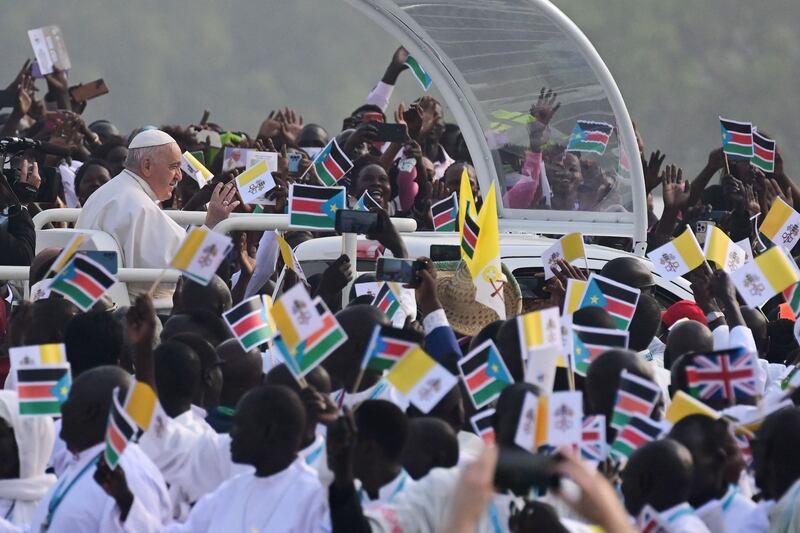 Pope Francis waves as he arrives for holy mass at the John Garang Mausoleum in Juba, South Sudan. AFP