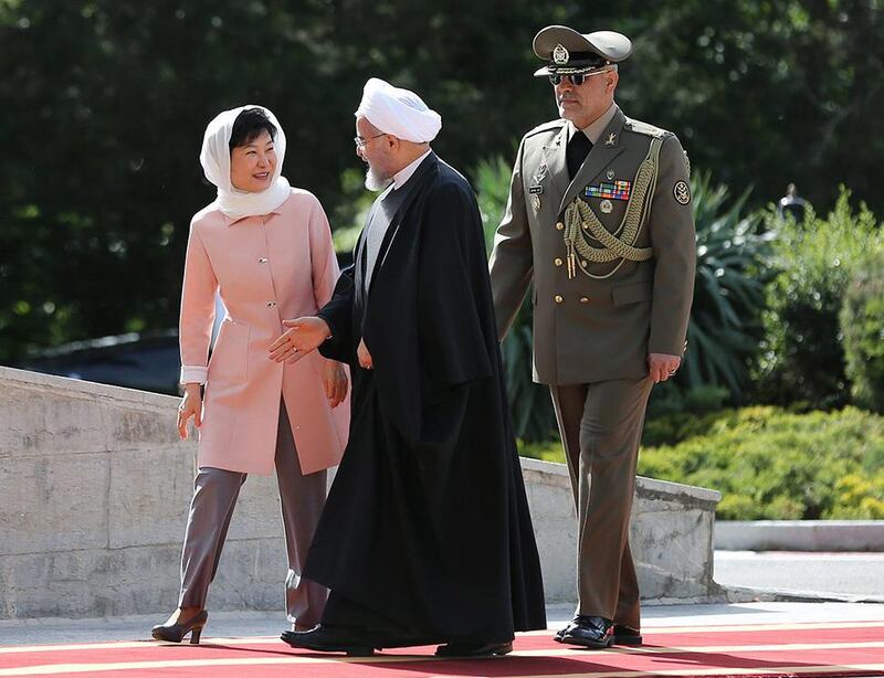 A handout picture provided by the office of Iranian president Hassan Rouhani welcoming South Korean president Park Geun-hye on May 2, 2016 at the presidential palace in the capital Tehran. AFP Photo/Iranian presidency



