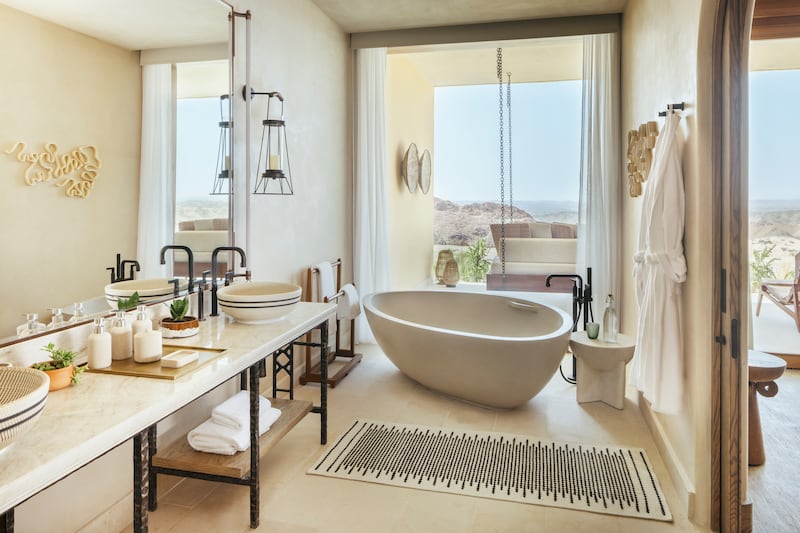 The rooms, suites and villas have generously sized bathtubs from which you can enjoy dune-filled views. Photo: Six Senses