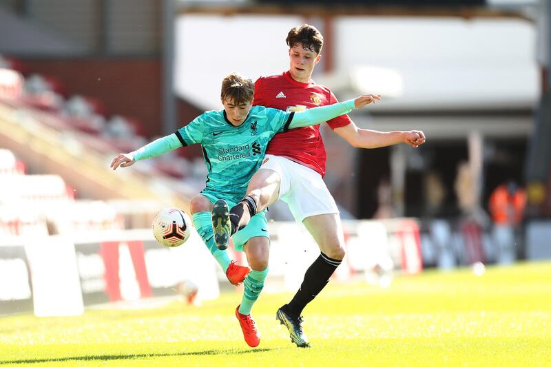 Liverpool's Max Woltman battles for possession with Will Fish of Manchester United during the FA Youth Cup Fourth round match at Leigh Sports Village. Getty Images